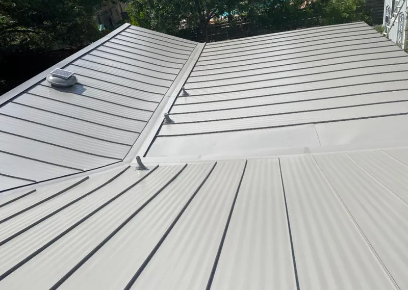 Solar attic fan installed on a metal roof for Roof Ventilation in Coppell