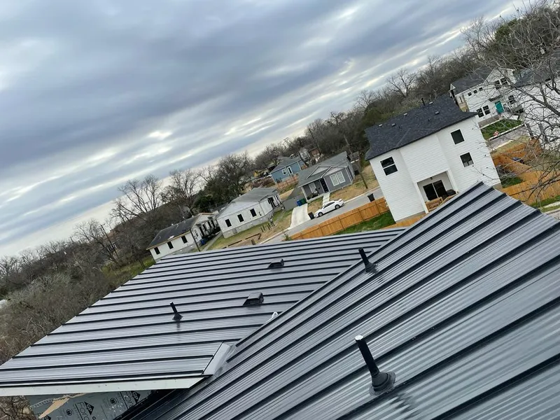 Standing seam metal roof panels with vents for Skylight Repair in Coppell